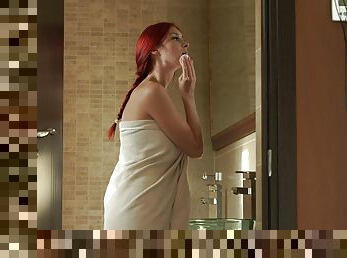 Redhead with a flawless body masturbates in the shower