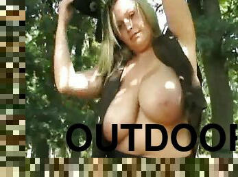 Stacked Wanessa Lilio shows off her massive tits while outdoors