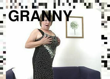 Golden dildo makes the big tits granny feel good