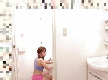 Sexy pigtailed Asian on the bathroom floor masturbating