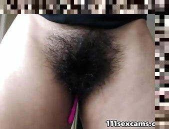 Horny girl showing her very hairy pussy and muscular body  in front of a webcam