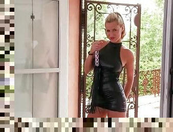 Tall blonde seductress in latex outfit teases
