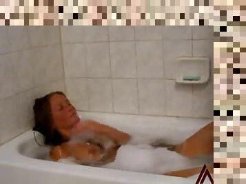 Amateur striptease and masturbation in bathtub
