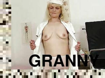 Naughty granny nurse dildoing her hairy pussy in the hospital