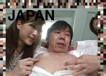 Erotic Japanese babes caressing their guy before giving him fascinating handjob in the office