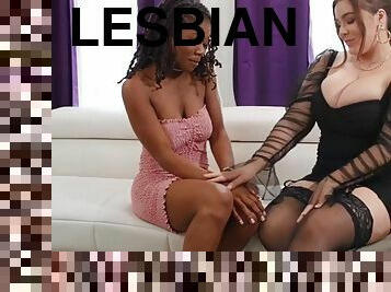 Chubby lesbian in stockings fucks her black friend with a strap-on