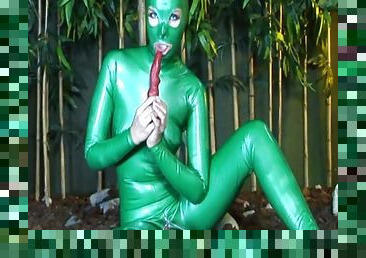 Babe Camila poses in hot green latex