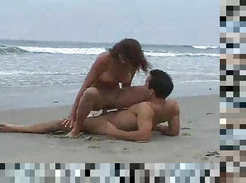 Couple having sex on an empty beach