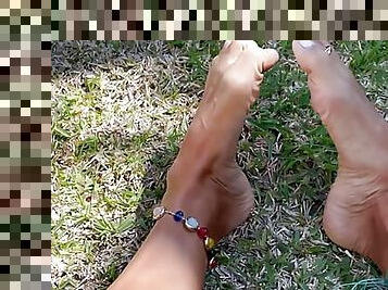 Sexy feet teasing outdoors