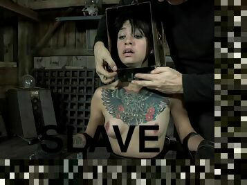 Tattooed brunette slave head getting caged in BDSM