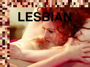 Lovely lesbian redheads kissing passionately and licking each other