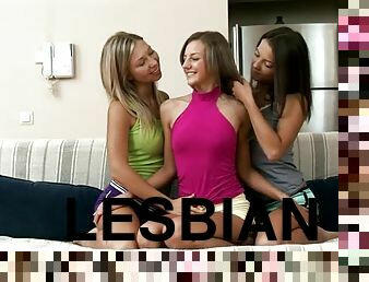 Three gorgeous girls fist each others pussies on the sofa