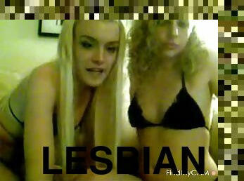 Horny lesbians rub pussies on cam