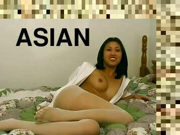 Very horny Asian girl rips her pantyhose off to get at her pussy