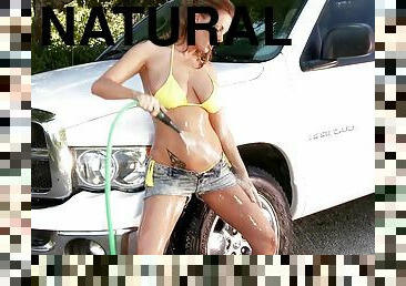 Sheila Grant wearing a bikini washes a car and her big natural tits