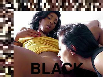 Dark-haired damsel pleasuring her black girlfriend