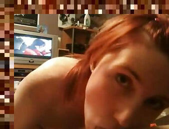 Teen redhead babe giving a POV blowjob on camera