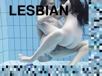 Enjoy an underwater redhead and lesbians