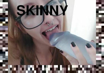 Skinny girl with big tits sucks huge dildo