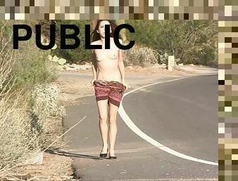 Lola strips naked and walks down a public street wearing only a smile