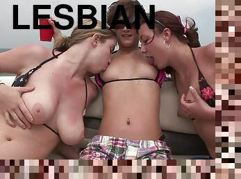 Bikini-clad lesbian with gorgeous natural tits enjoying a threesome on a yacht