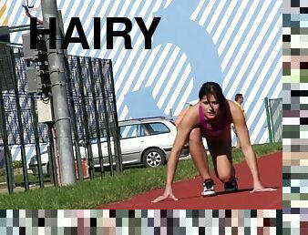 A hot track star finishes her workout by fucking her hairy pussy