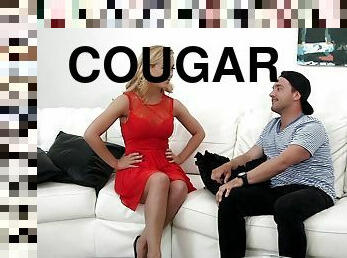 Blonde cougar Cherie Deville spreads legs to be fucked on a sofa