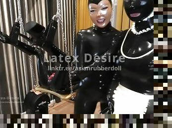Maid cleans a rubber pussy with her tongue