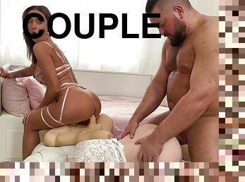 Couple playing with male and female sex dolls