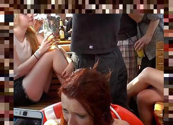 Horny redhead fucked in public in front of many voyeurs