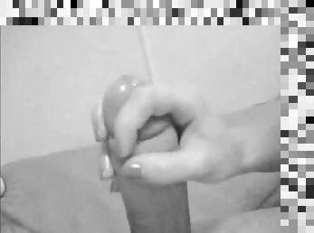 Black-and-white video of a nasty girl giving a handjob