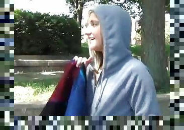Blonde fucks her pussy with toy in public park