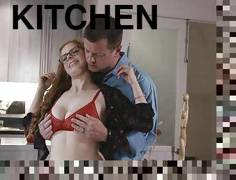 Redhead chick Penny Pax gets undressed and fucked in the kitchen