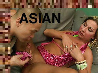 Asian guy worships blonde shemale's feet before anal
