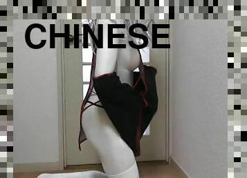 White crossdresser cat wears chinese vampire costume and gloves