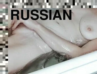 girl masturbates in the bath after a working day