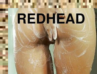 Lithe teen redhead looks smoking hot taking a shower