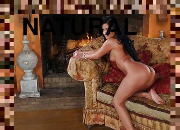 Sensual Playboy Playmate gets naked and relaxes on the couch