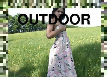 Outdoors solo masturbation shoot with captivating brunette
