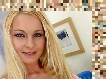 This sexy blonde has some nice natural tits and a great shaved pussy