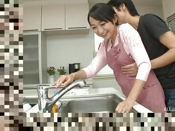 Takita Eriko is a horny housewife fucked doggystyle in a kitchen