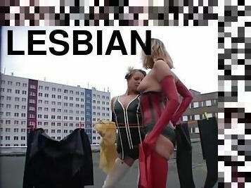 Rooftop lesbian sex with a pair of sexy latex babes
