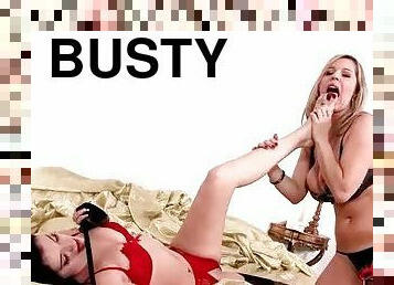 Busty girl sucks on toes lustily