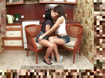 Brunette hotties licking each other in the kitchen