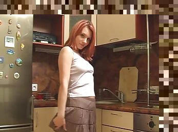 Sexy redhead Alyssa strips and masturbates in kitchen