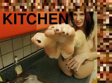 Joanna Angel washes her feet in a sink then uses her dildo
