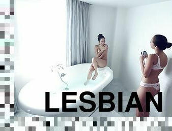 Two hot girls get in the bath and tongue fuck each other