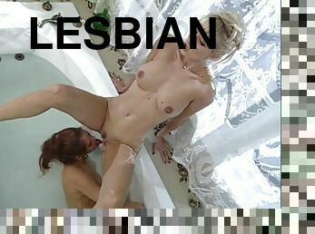 Nasty lesbian action along models licking wildly in the bathroom