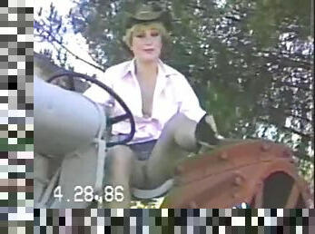 Cowgirl wife on the tractor smiles as she shows her cunt upskirt