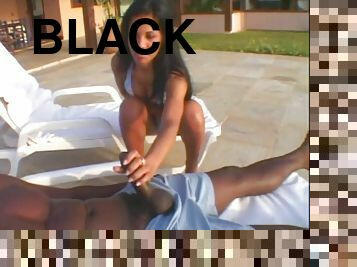 Black dick gets a blowjob in the tropics from this bikini beauty